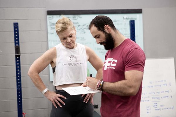 Image of Gillian and her coach at the gym
