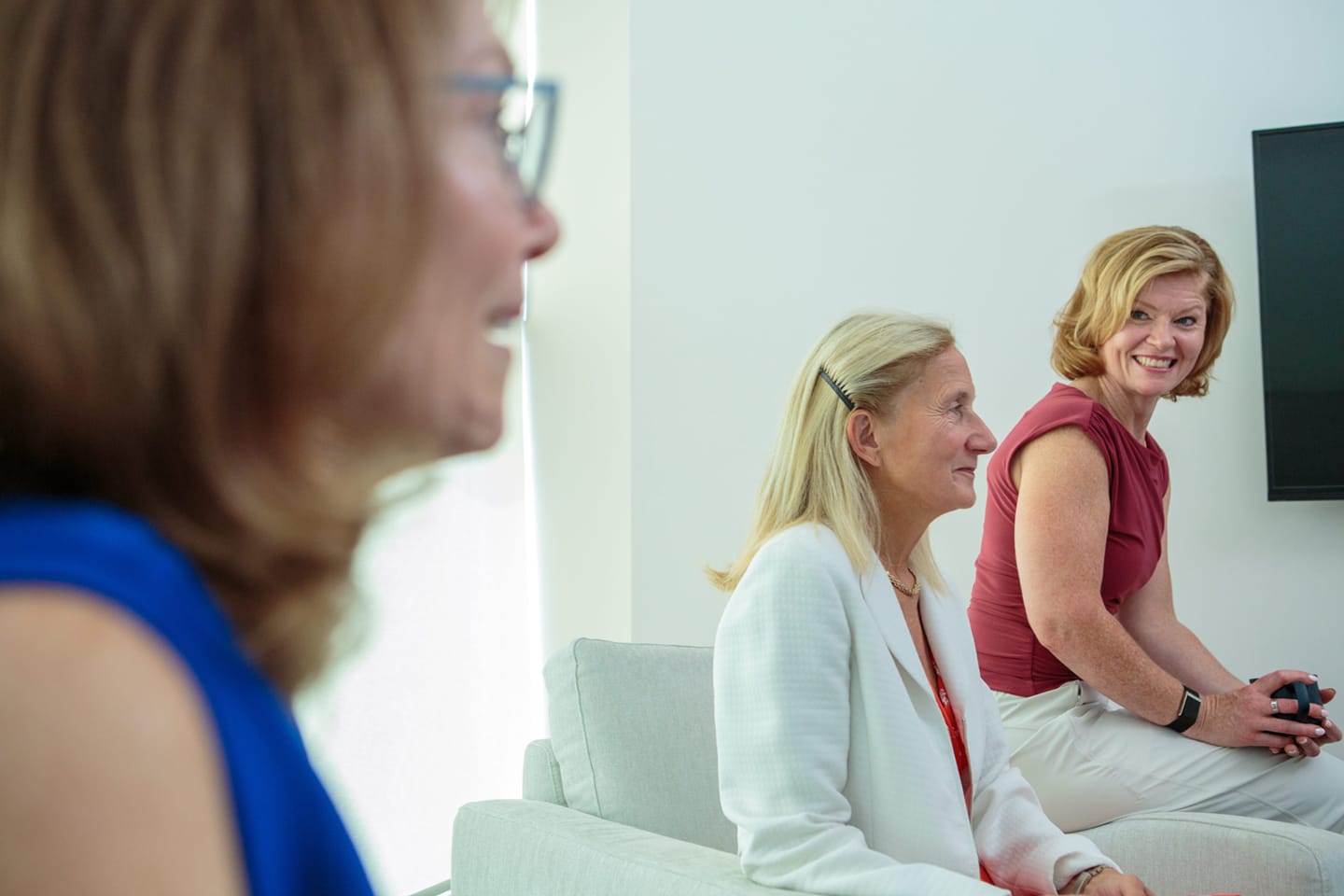 Image of Gillian and 2 other women sitting in in a room conversing